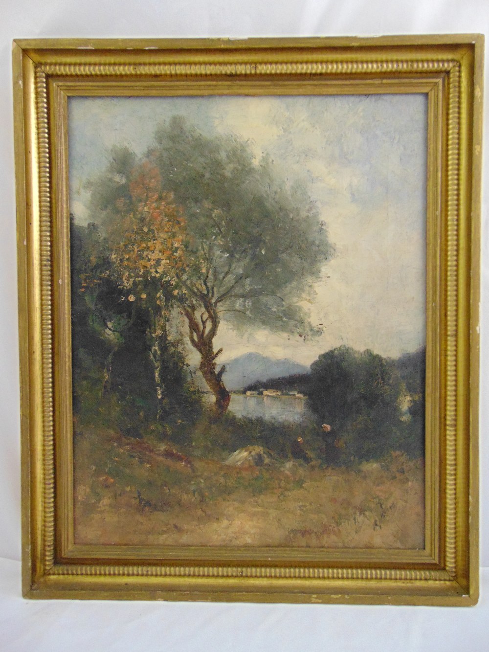 A framed oil on canvas of a landscape with figures in the foreground, 52 x 41cm