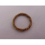 A gold rope twist ring, tested 9ct, approx total weight 2.6g