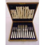 A cased set of twelve pairs of silver and mother of pearl dessert eaters, Sheffield 1919