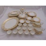 Wedgwood Gold Damask dinner service to include plates, serving dishes, meat plates, cups, saucers,