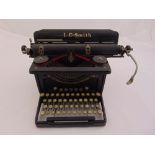 L C Smith and Corona typewriter of customary form