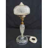 Cut glass table lamp of baluster form on raised circular base with detachable cut glass shade, 41.