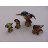 Four Beswick figurines of birds