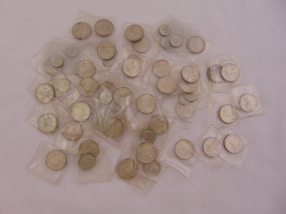 A quantity of pre 1947 silver coins to include florins, shillings and sixpences, all in individual