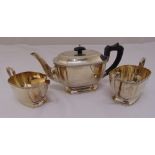 A silver three piece teaset, of elongated octagonal form with chevron borders on raised octagonal