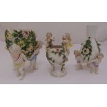 Three Sitzendorf vases decorated with flowers leaves and applied putti