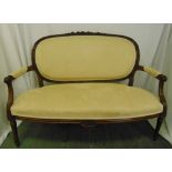 A Victorian mahogany two seater upholstered sofa on turned tapering legs, 95 x 127 x 71cm