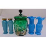 A hand painted green glass jar and cover, a pair of blue milky glass Victorian vases and a pair of