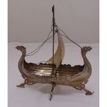 A white metal model of a Viking ship in full sail A/F, approx total weight 542g, 30cm (h) 30cm (w)