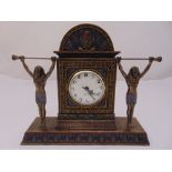 A Veronese Egyptian revival style mantle clock with white enamel dial flanked by two Egyptian