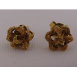 A pair of 9ct yellow gold earrings in the form of flowers, approx total weight 1.4g