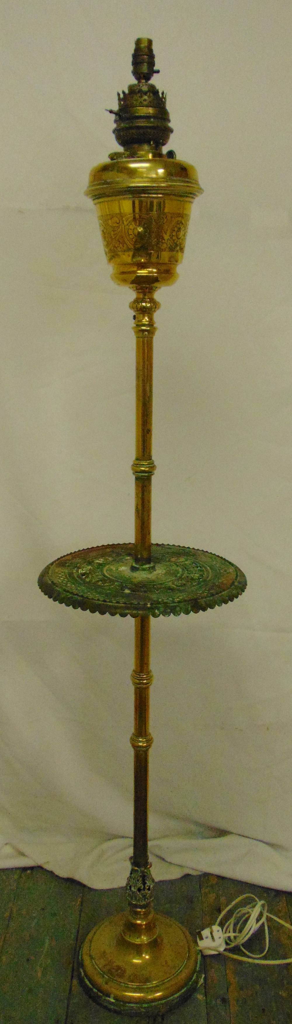 An early 19th century brass standard lamp of columnular form on raised circular base, 148cm (h)