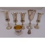 A quantity of silver to include six Kiddush cups of various form and a filigree thimble, approx