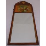 A rectangular wall mirror in 18th century style, the top painted with flowers and leaves, 79.5 x