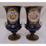 A pair of Meissen campagna vases decorated with floral sprays on raised circular bases, 25cm (h)