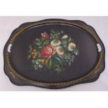 A Russian hand painted shaped oval metal tea tray with inset side handles decorated with flowers,