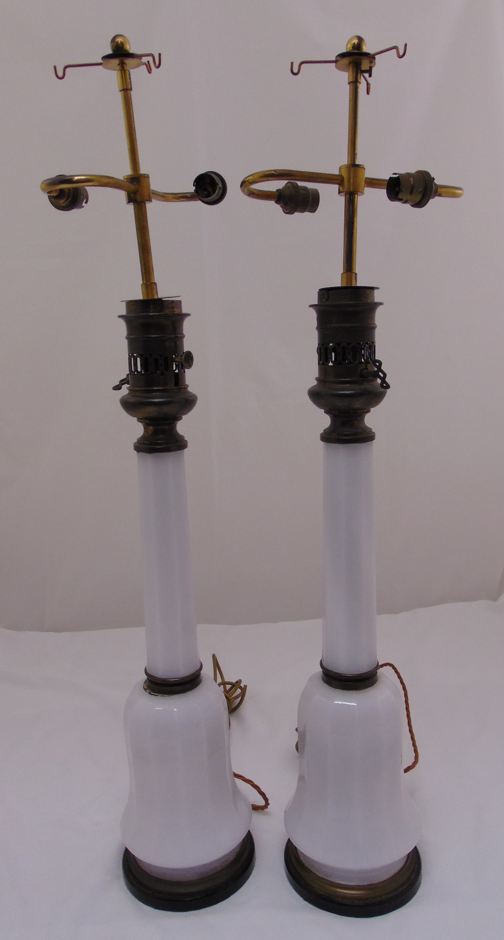 A pair of Victorian milk glass table lamps converted to electricity, 88cm (h)