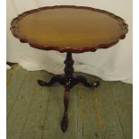 A Victorian mahogany tilt top piecrust wine table on three outswept legs, 64cm (h) 62cm (dia)