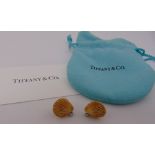 A pair of Tiffany 14ct yellow gold and diamond shell shaped earrings, approx total weight 3.8g