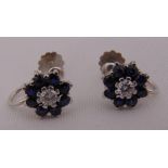 A pair of 18ct white gold sapphire and diamond cluster earrings with screw fittings, approx total