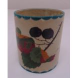 Wemyss cylindrical pen holder decorated with fruit and leaves, marks to the base. 10cm (h)