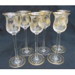 A set of six gilded glass liqueur glasses on circular spreading bases