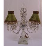 A 19th century crystal two branch lamp stand with crystal drops on stepped square base,