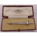 White gold and diamond brooch in the form of a sword, largest stone approx 1.21ct, tested 18ct,