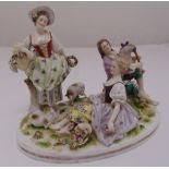 Tieme and Postschappel figural group of a shepherd and shepherdess with sheep on raised oval base,