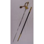 An early 20th century presentation sword and scabbard with gold braiding to the handle by