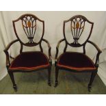 A pair of Hepplewhite style mahogany upholstered carvers, one A/F