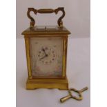 A French gilded metal repeating carriage clock with painted side panels and dial, to include key, 12