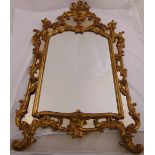A gilded wooden Rococo style hall mirror of pierced rectangular form, 137 x 83cm