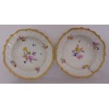 A pair of Meissen dishes decorated with floral sprays, leaves and gilded borders,