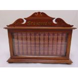 Twelve leather bound William Shakespeare volumes dated 1888 in original glazed wooden cabinet on