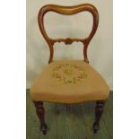 A Victorian mahogany balloon back chair with upholstered seat on turned legs