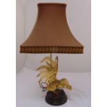 A gilded metal table lamp in the form of a cockerel on circular wooden base, to include shade,