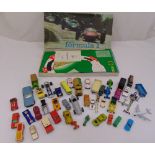 A quantity of diecast cars, trucks and Waddingtons car racing game Formula 1