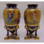 A pair of Vienna decorative ovoid vases of classical form decorated with figures to the sides on