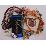 A quantity of costume jewellery to include necklaces and beaded bracelets