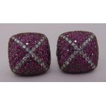 A pair of pink sapphire and diamond earrings set in white gold tested 18ct, to include insurance