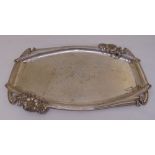 A continental white metal Art Nouveau style tray of shaped rectangular form decorated with flowers