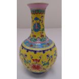 A Chinese yellow ground baluster vase decorated with lotus flowers, marks to the base, 24cm (h)