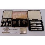 A quantity of hallmarked silver to include a condiment set, a cased set of teaspoons and a cigarette