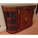 A Louis XVI style shaped rectangular credenza, the two side cupboards with curved glazed doors,