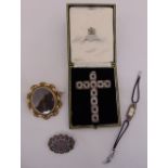 A gem set crucifix, a Victorian pinchbeck brooch, a Victorian silver and gold brooch and an Art Deco