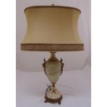 An onyx baluster form table lamp with gilt metal mounts on circular base, to include shade, 78cm (