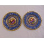 A pair of Crescent China cabinet plates blue ground, gold border surrounding a cluster of fruit to