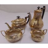 A Victorian Mappin and Webb four piece silver tea and coffee set, oval part fluted with angled