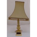 A gilded metal and onyx lamp stand on square plinth to include shade , 74cm (h)